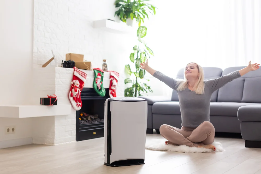 Air purifier and happy woman stretching