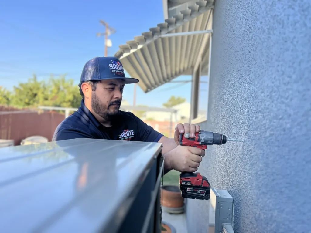 Salute technician holding drill